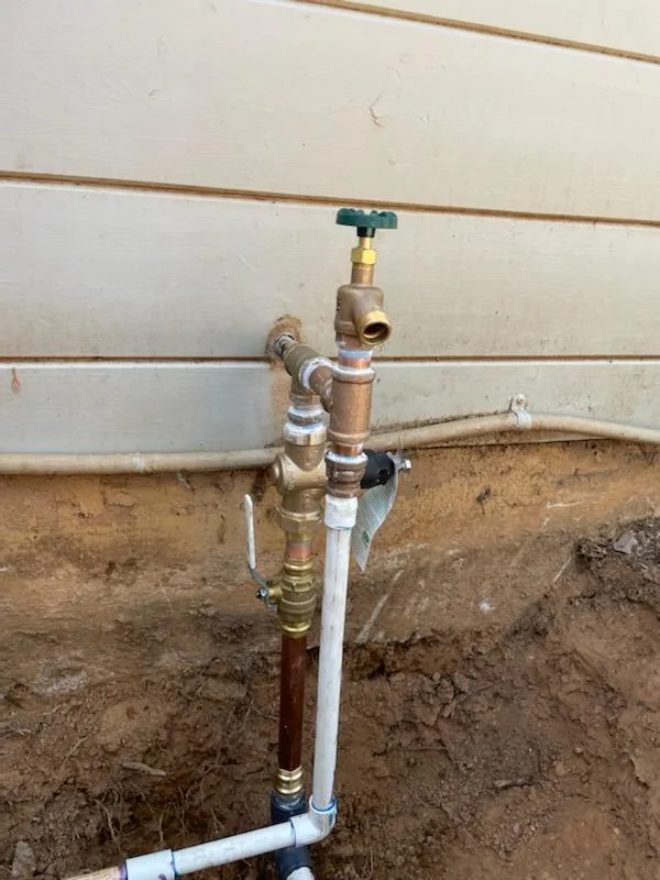 Exterior water supply pipes with a shutoff valve and hose connection